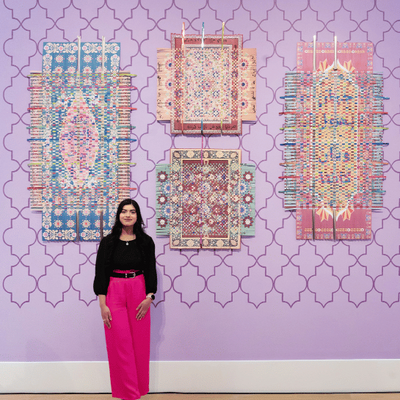 Ammna Sheikh stood with her artwork after winning the Tonic Arts Purchase Prize