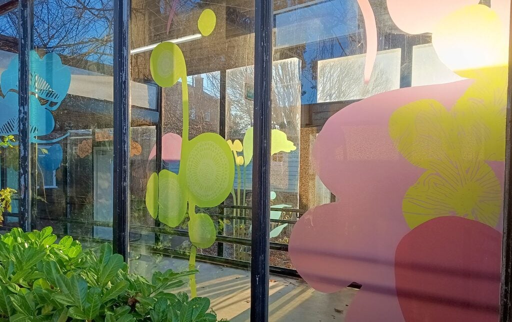 Sharon Quigley's vinyl designs on the glass corridor at the Royal Edinburgh Hospital