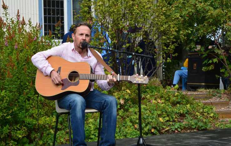 Charlie Gorman, musician and guitarist, playing guitar