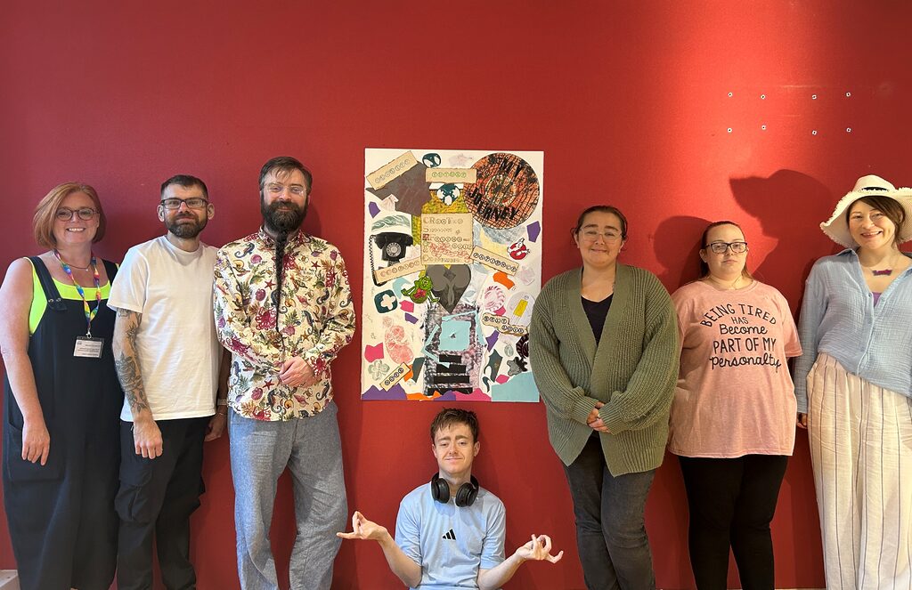 Group of young adults infront of abstract artwork