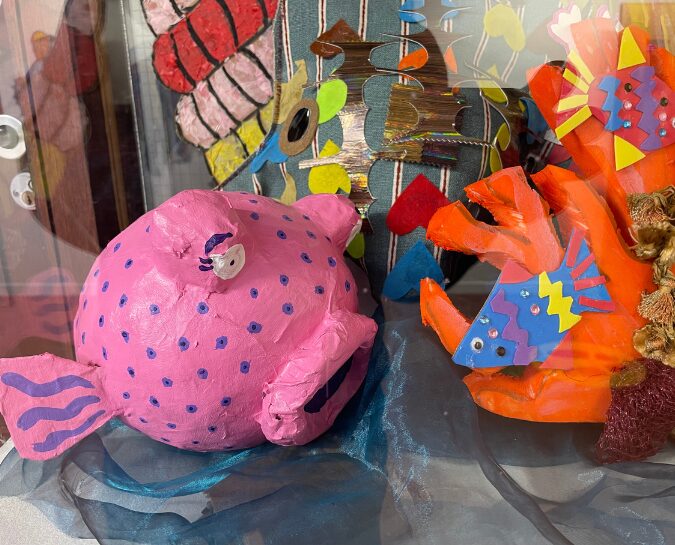 Fish artwork in pink and orange
