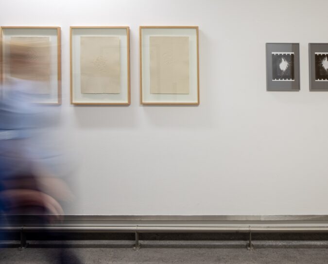Person walking past Daniele Sambo's work