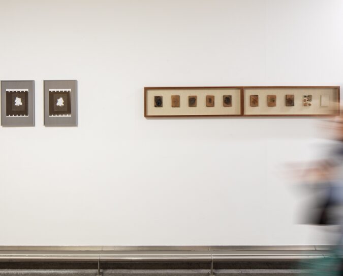 Person walking past Daniele Sambo's work