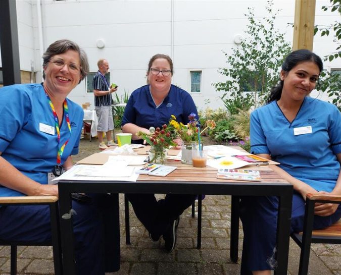 Staff outside doing watercolour painting