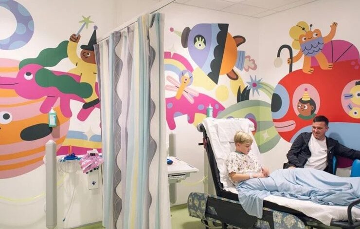 Crichton Ward with boy and dad in hospital bed